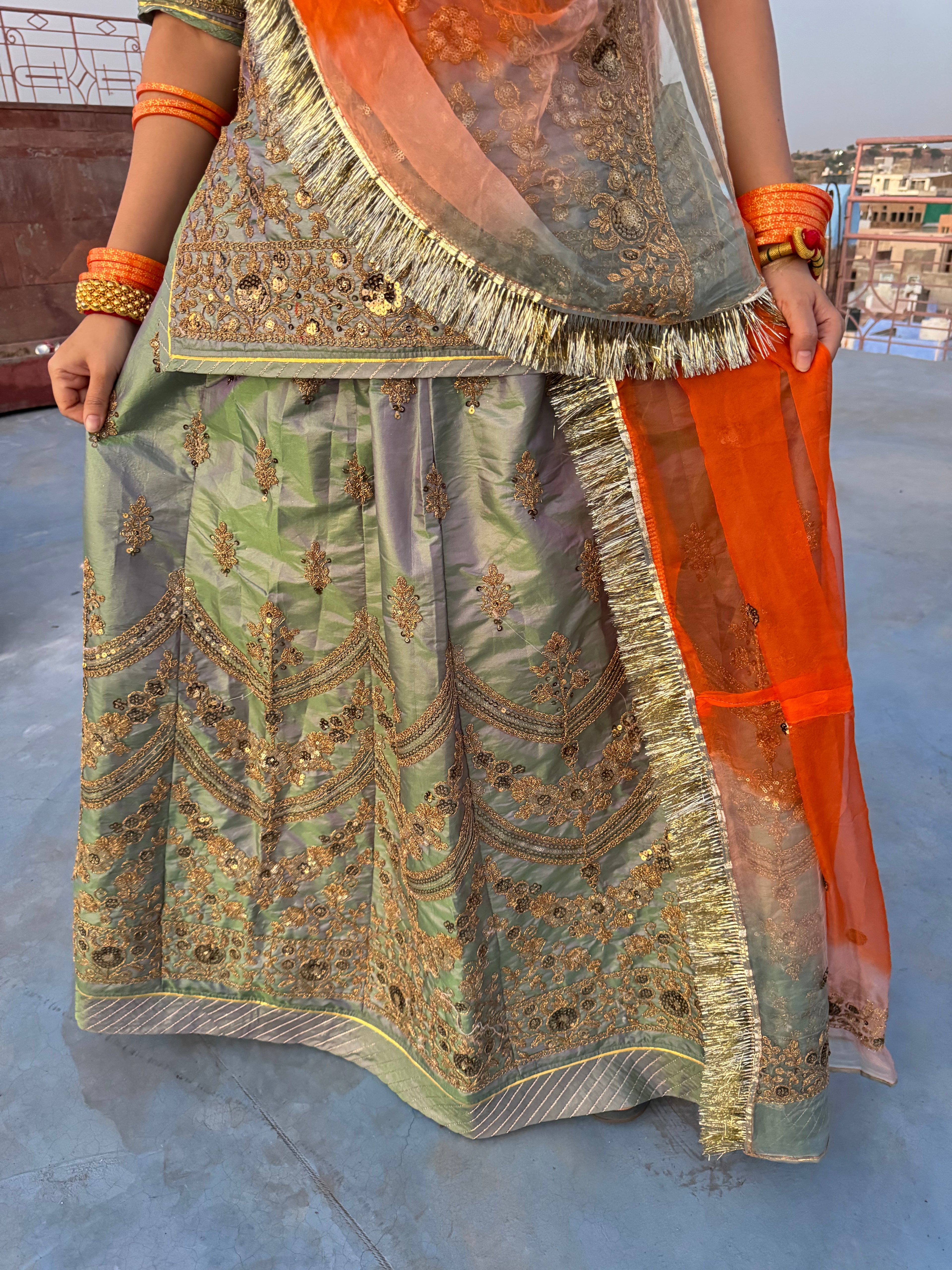 Bindani Graceful Harmony: Mehendi Green Poshak with Contrasting Odhna