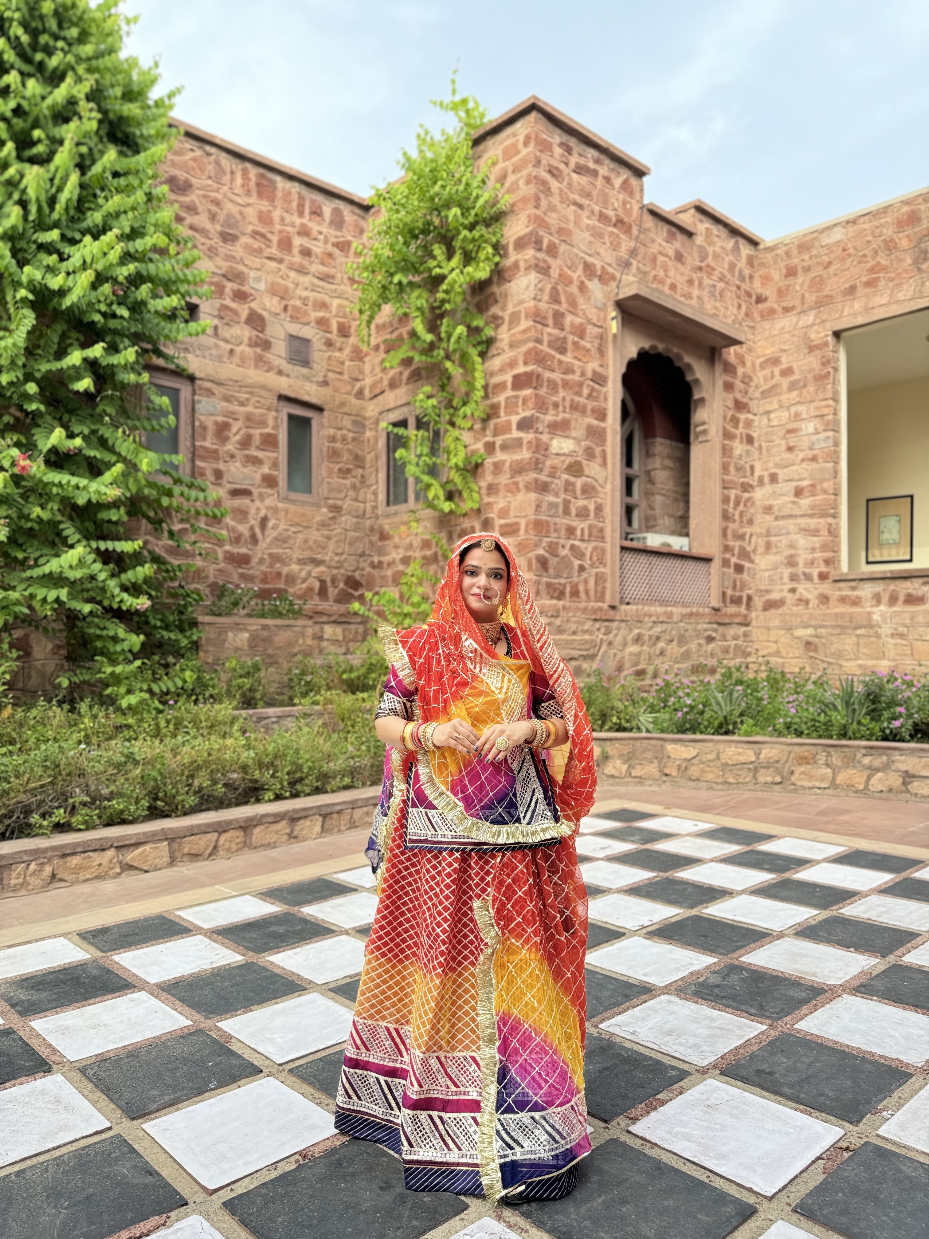 Bindani Chic and Colorful: Stunning Organza Poshak with Intricate Gota Accents(Semi stich)
