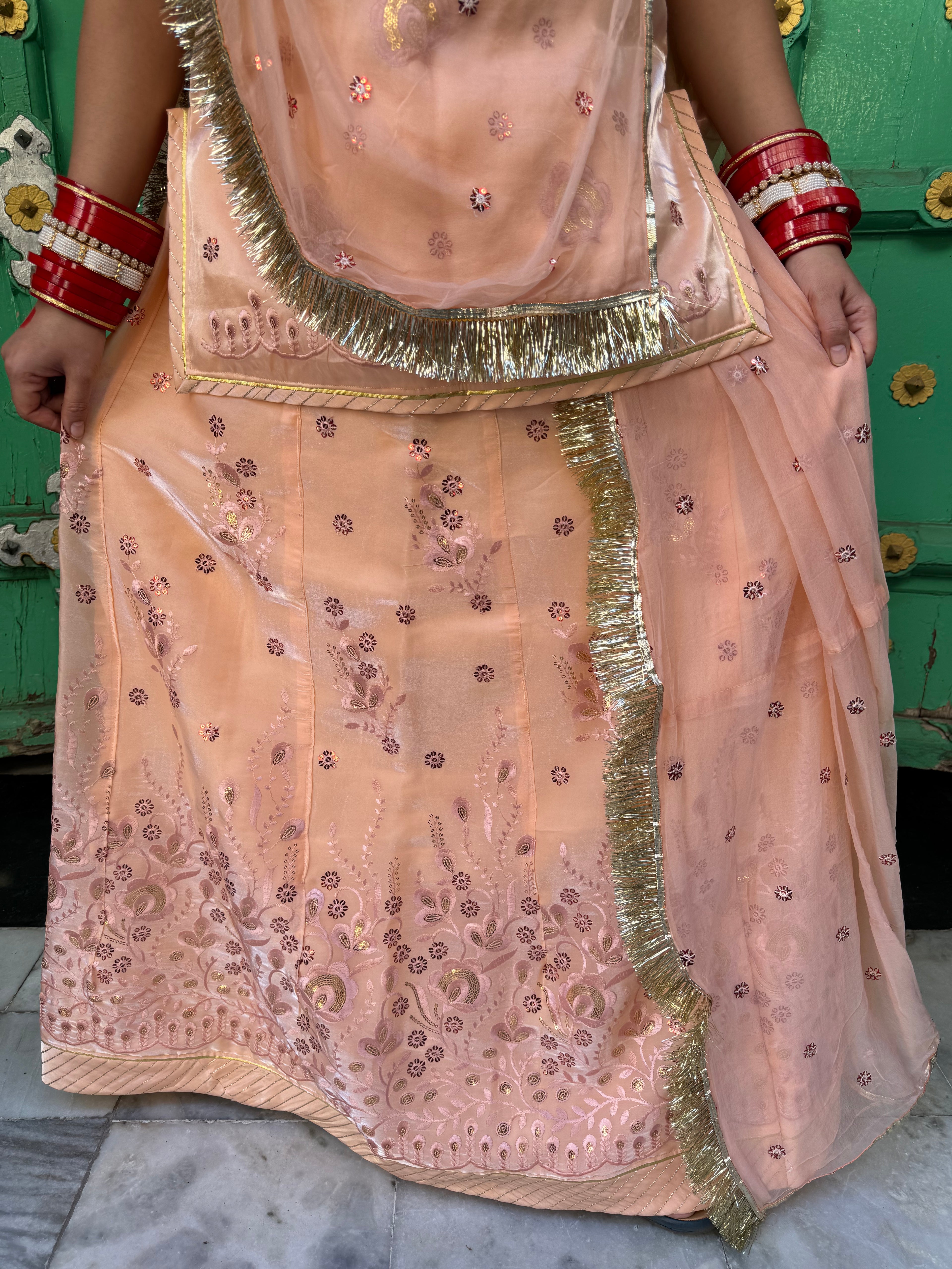 Bindani Elegant Peach Tissue Poshak with Button-Embellished Odhna