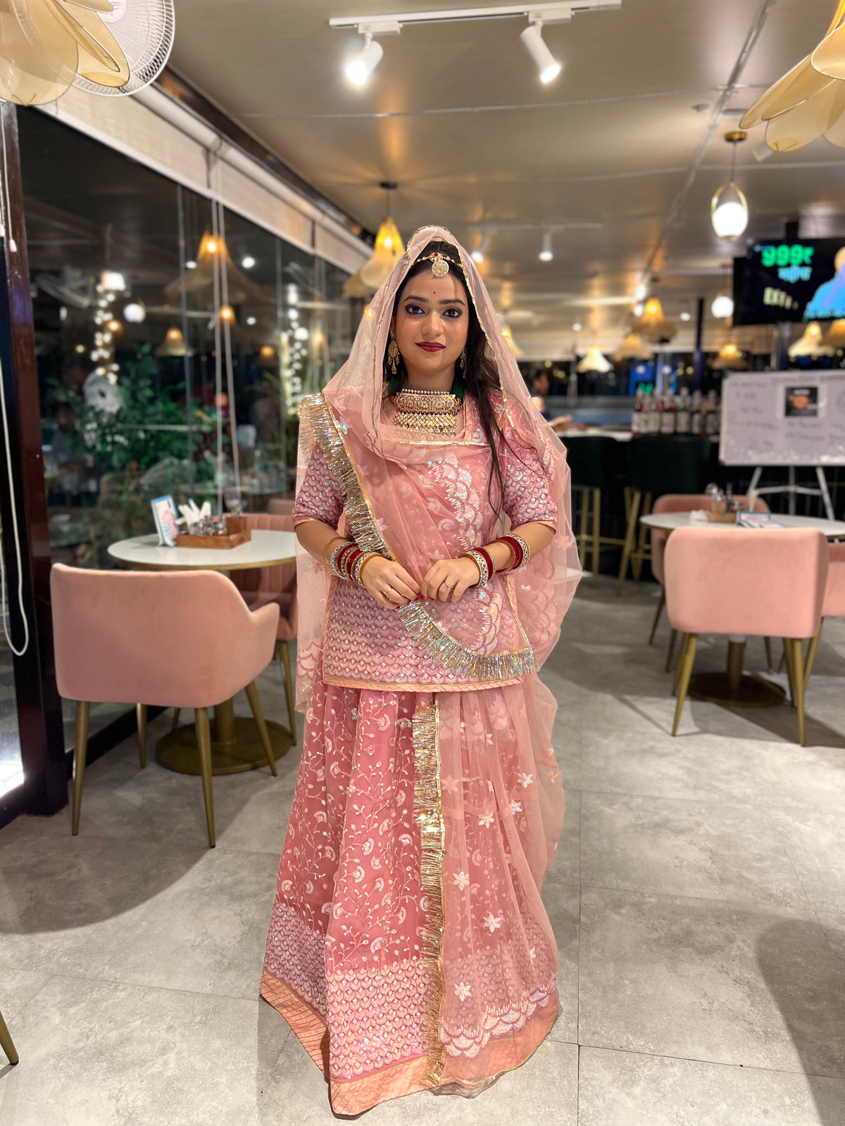 Blushing Elegance: Pink Net Poshak with Sheer Net Odhna(Semi stich)