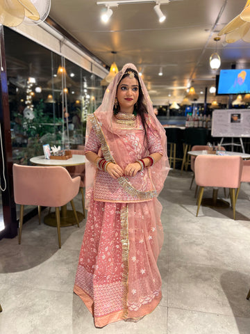 Blushing Elegance: Pink Net Poshak with Sheer Net Odhna(Semi stich)