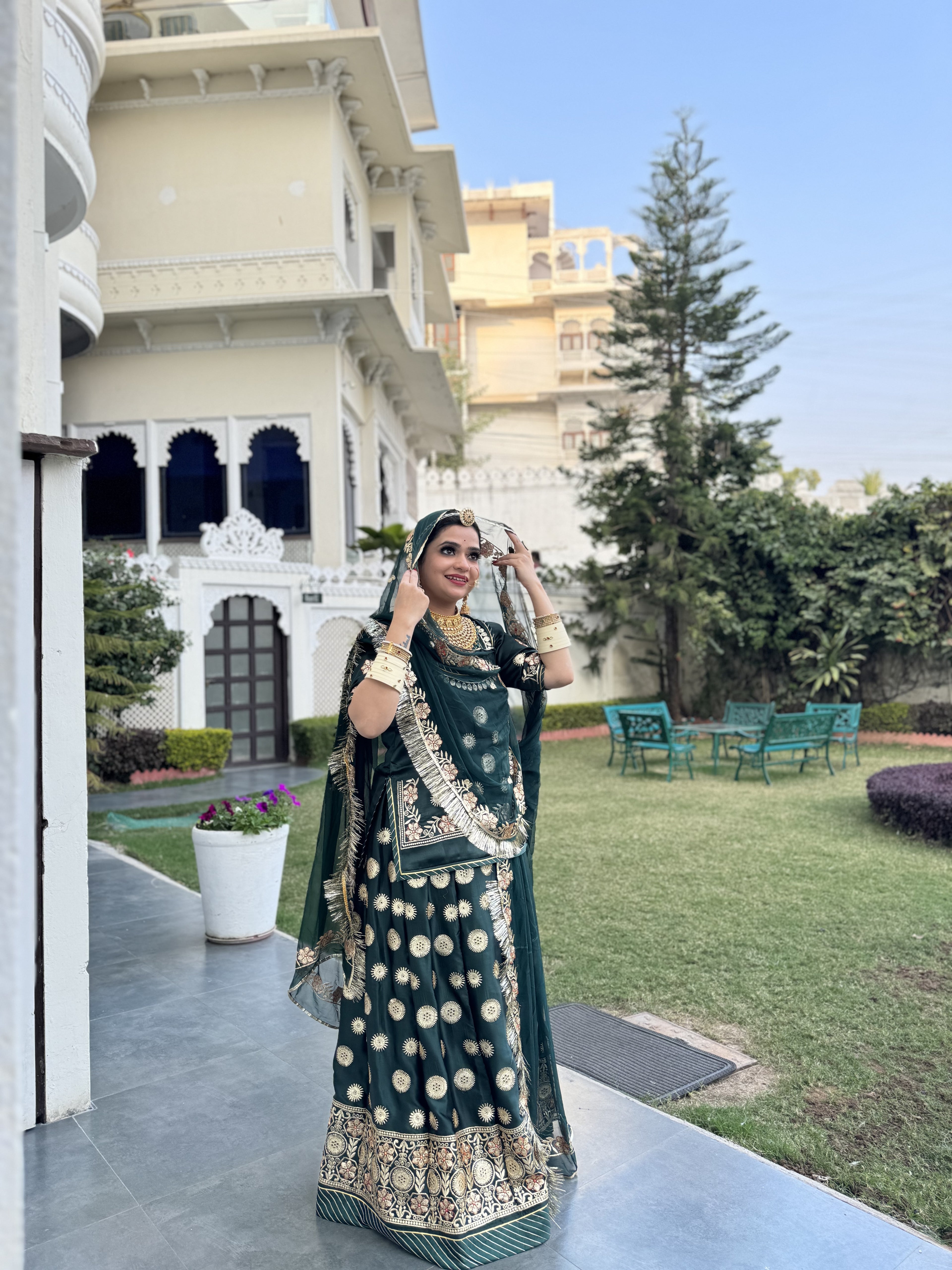 Emerald Elegance: A Green Satin Poshak Adorned with Zari Brilliance