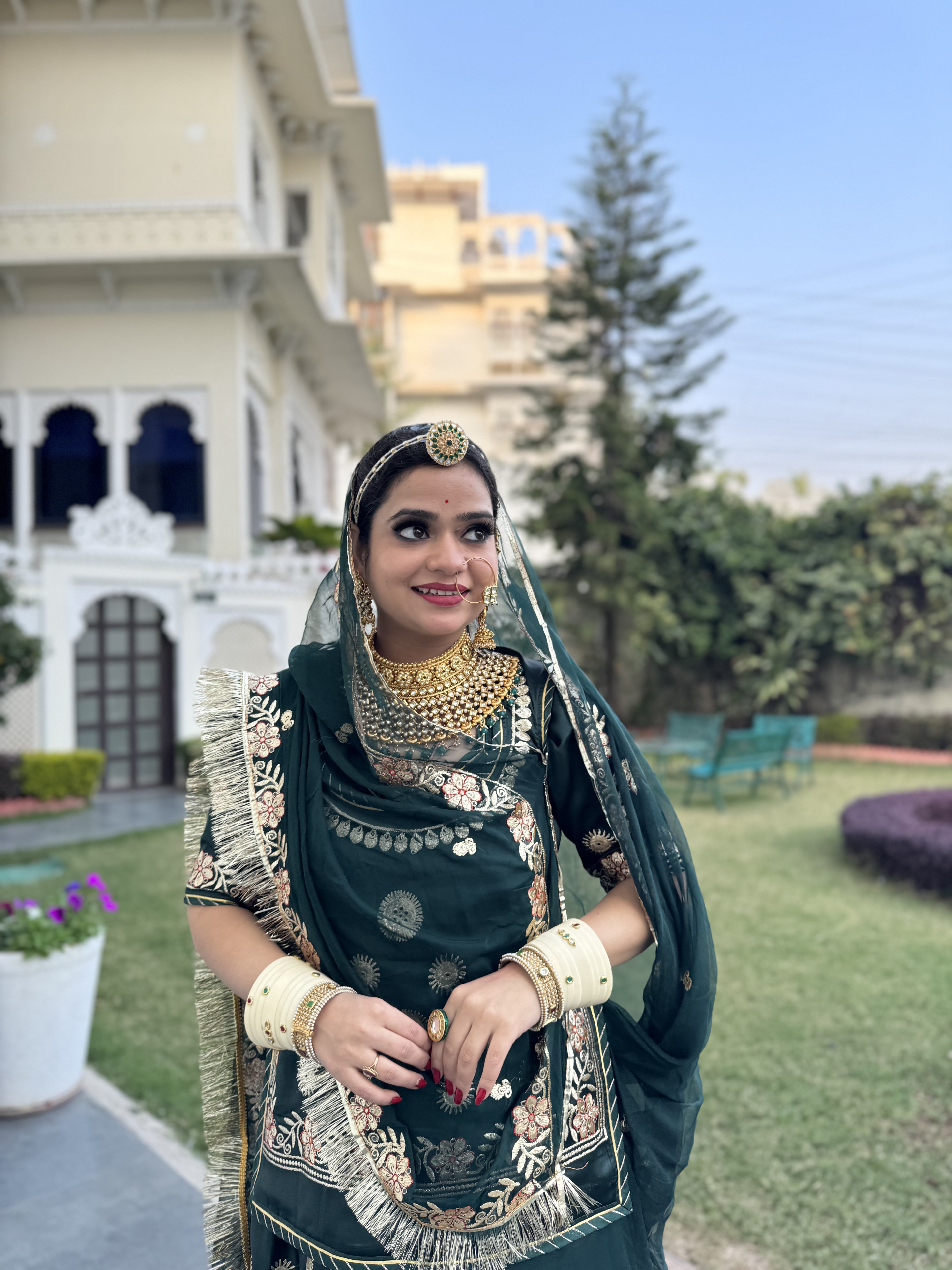 Emerald Elegance: A Green Satin Poshak Adorned with Zari Brilliance