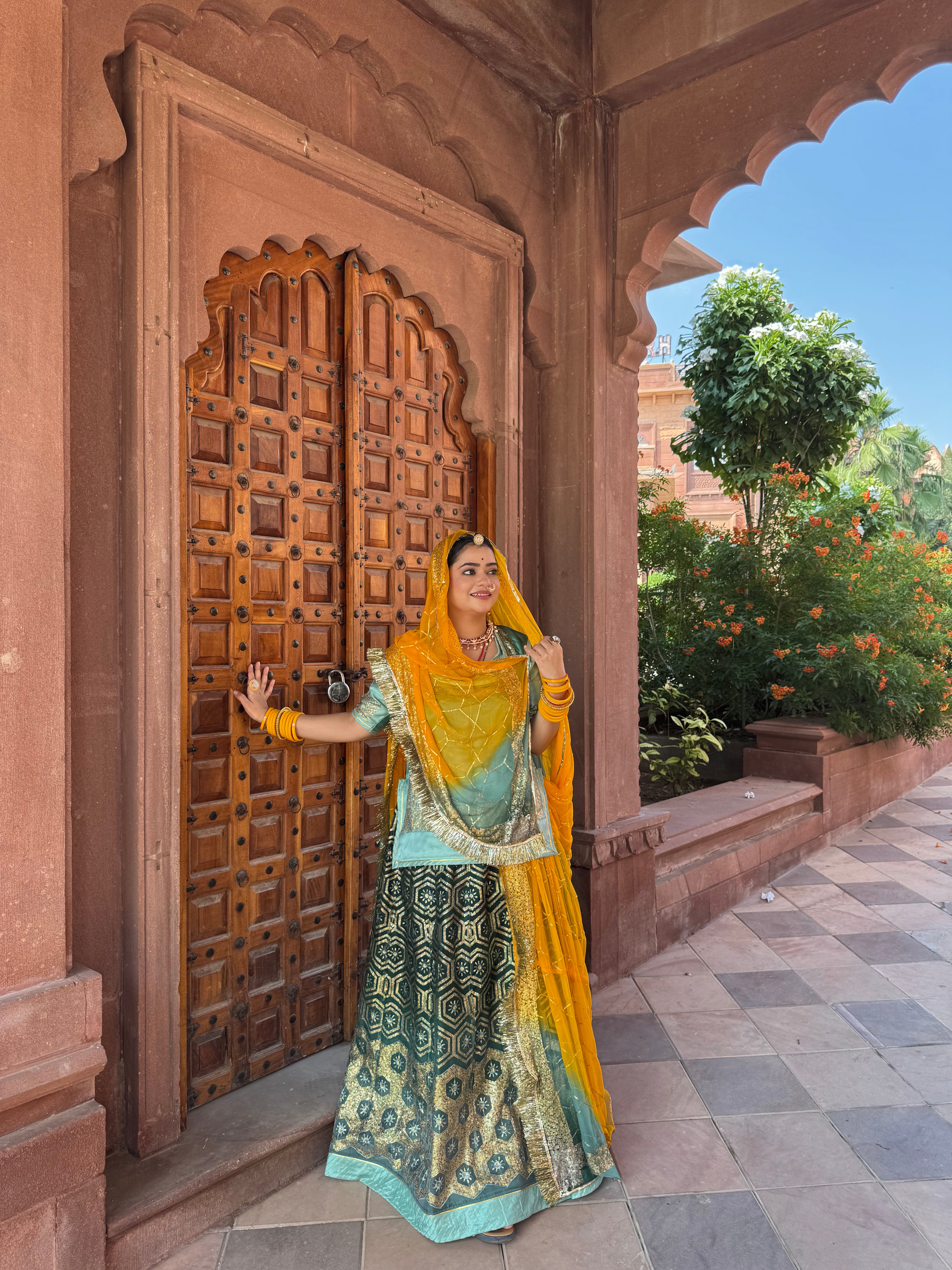 Bindani Emerald Grace: The Green Organza Poshak with Contrast Odhna