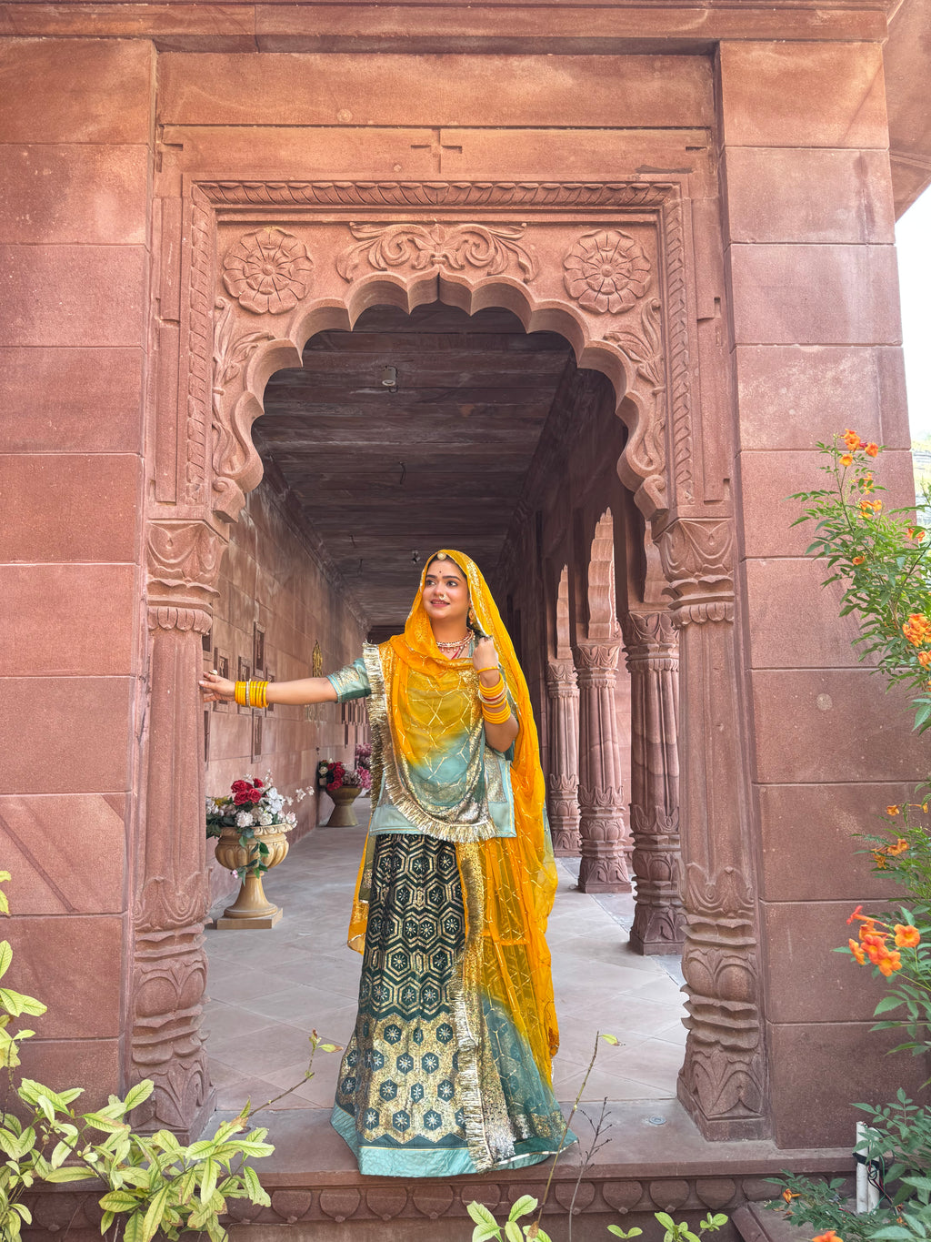 Bindani Emerald Grace: The Green Organza Poshak with Contrast Odhna