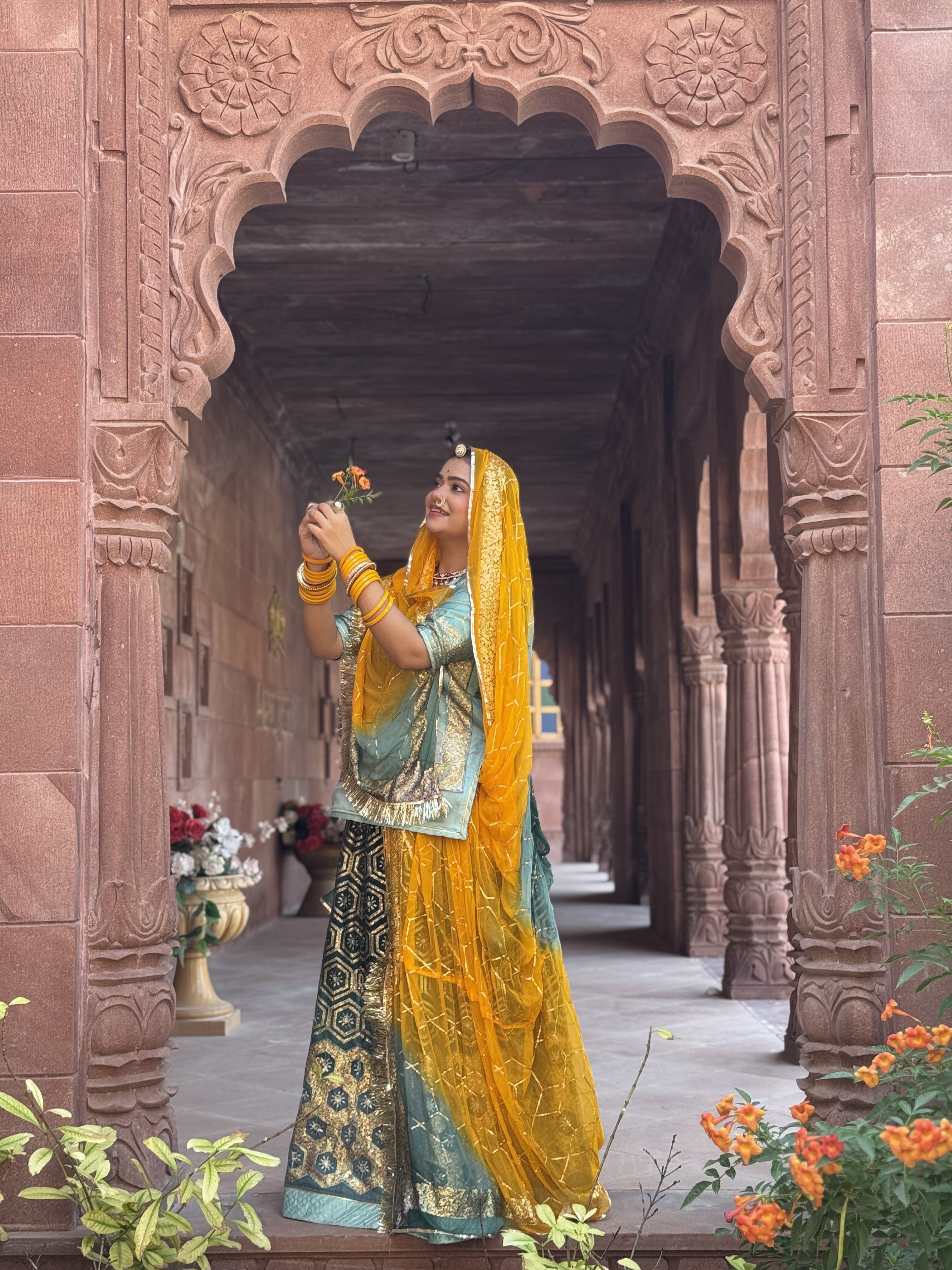 Bindani Emerald Grace: The Green Organza Poshak with Contrast Odhna
