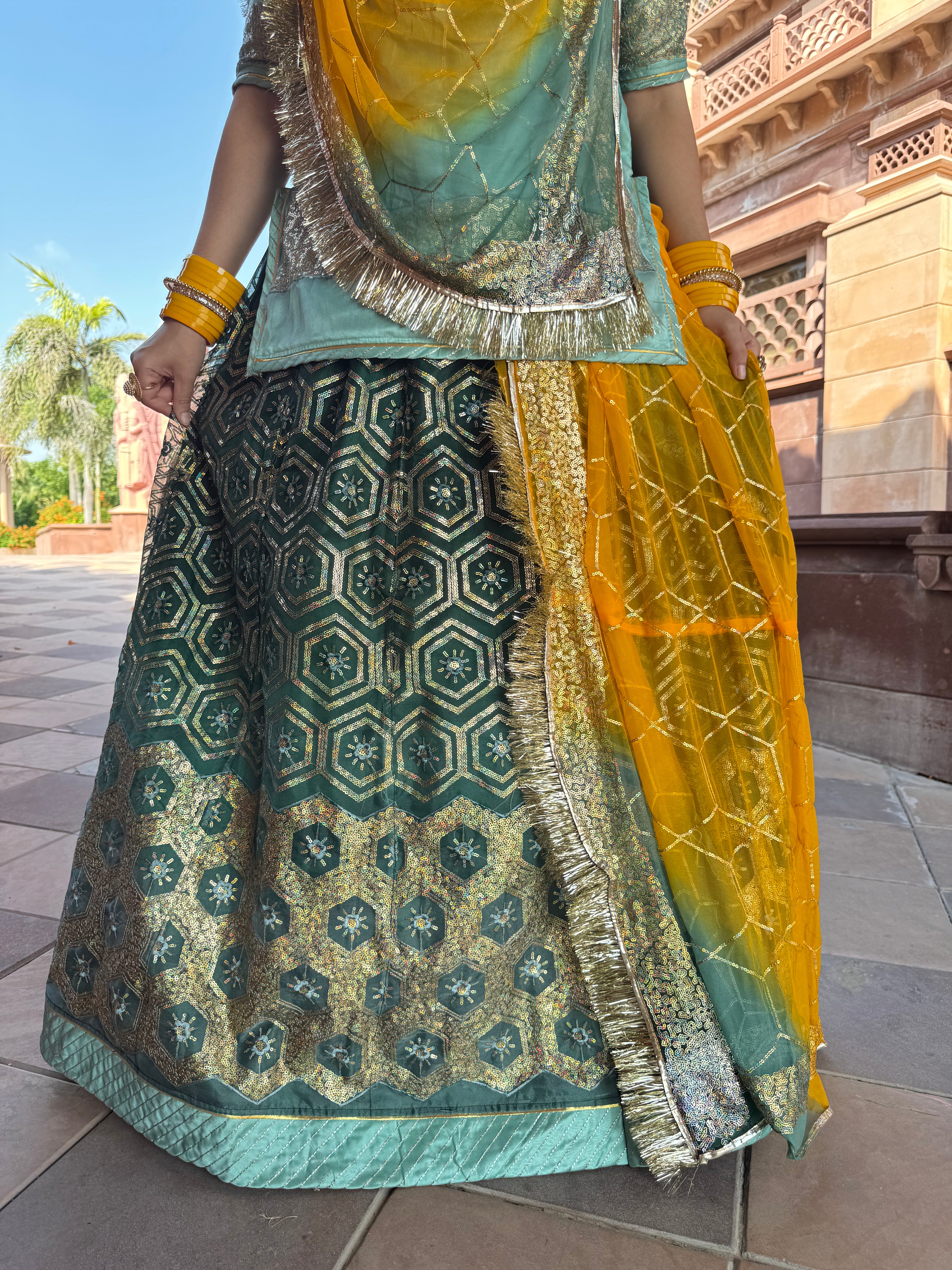 Bindani Emerald Grace: The Green Organza Poshak with Contrast Odhna