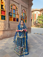 Bindani Floral Fantasy: Blue Tissu Poshak with Delicate Flower Embroidery(Semi stich)