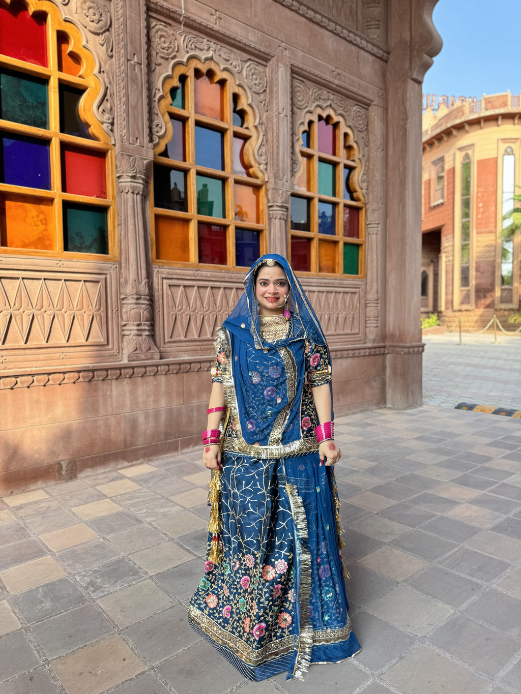 Bindani Floral Fantasy: Blue Tissu Poshak with Delicate Flower Embroidery(Semi stich)