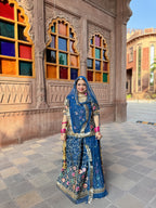 Bindani Floral Fantasy: Blue Tissu Poshak with Delicate Flower Embroidery(Semi stich)