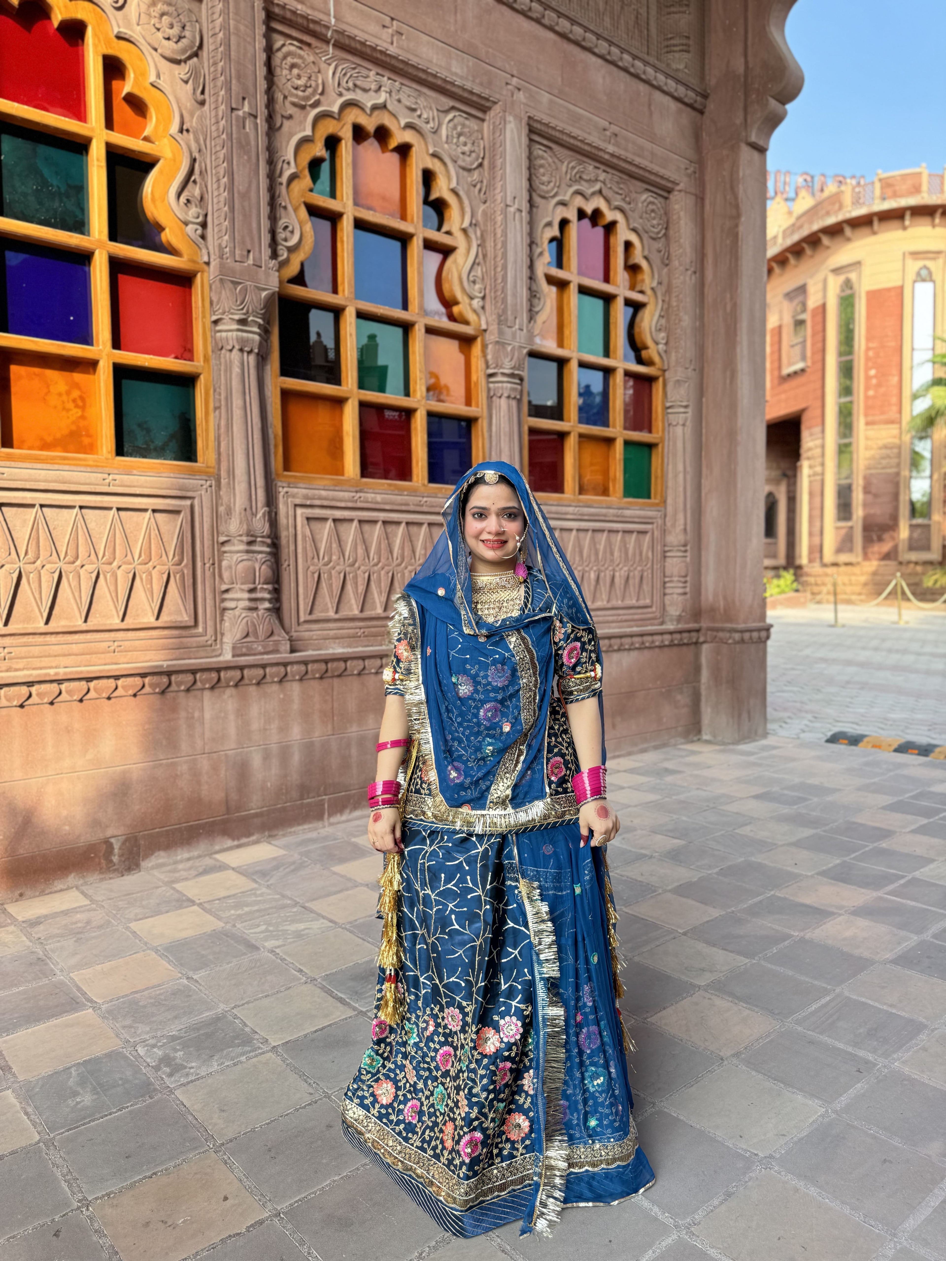 Bindani Floral Fantasy: Blue Tissu Poshak with Delicate Flower Embroidery(Semi stich)