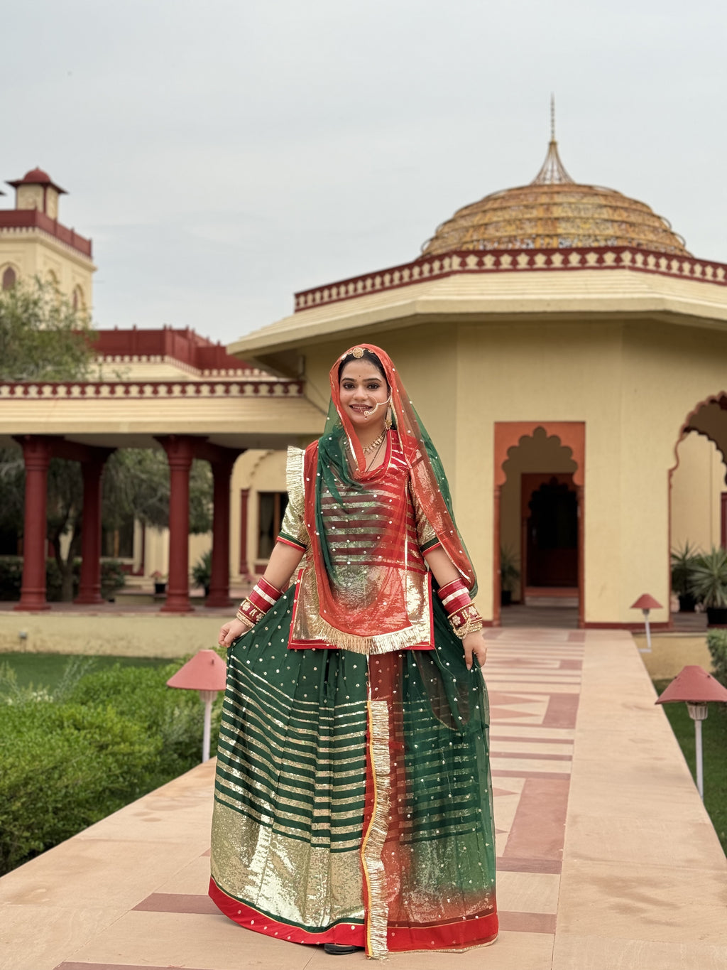 Bindani Emerald Elegance: Satin Green Poshak with Sequence Work