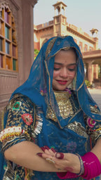 Bindani Floral Fantasy: Blue Tissu Poshak with Delicate Flower Embroidery(Semi stich)